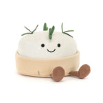 Jellycat Amuseables Camembert, smiling cream cheese plush in a cord container