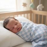 Alimrose blue check muslin swaddle lifestyle